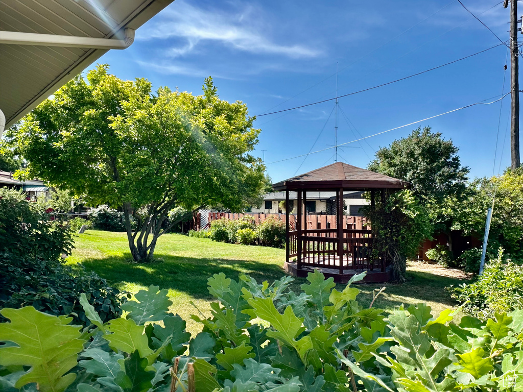 View of grassy yard featuring a gazebo