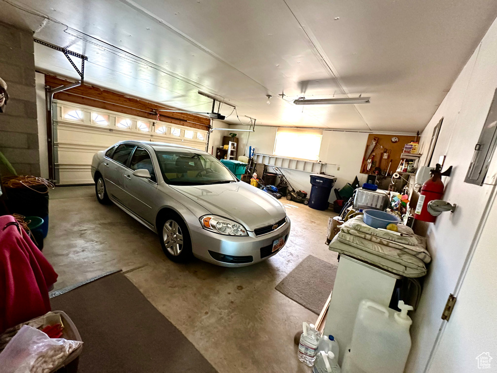 Garage featuring a garage door opener