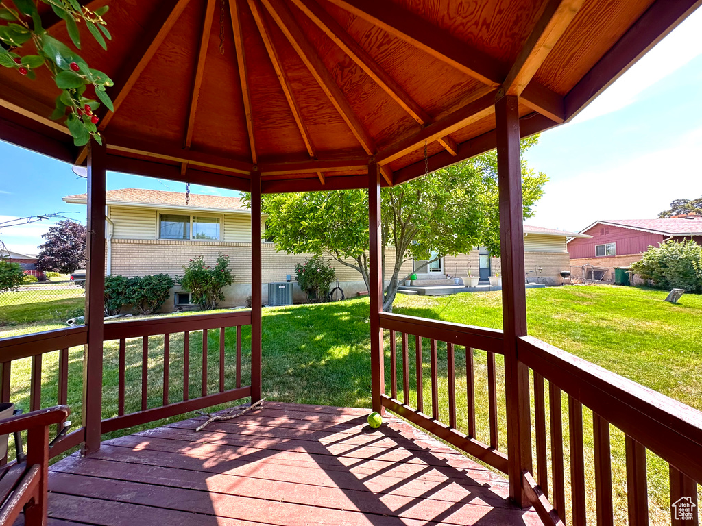Wooden terrace featuring a gazebo
