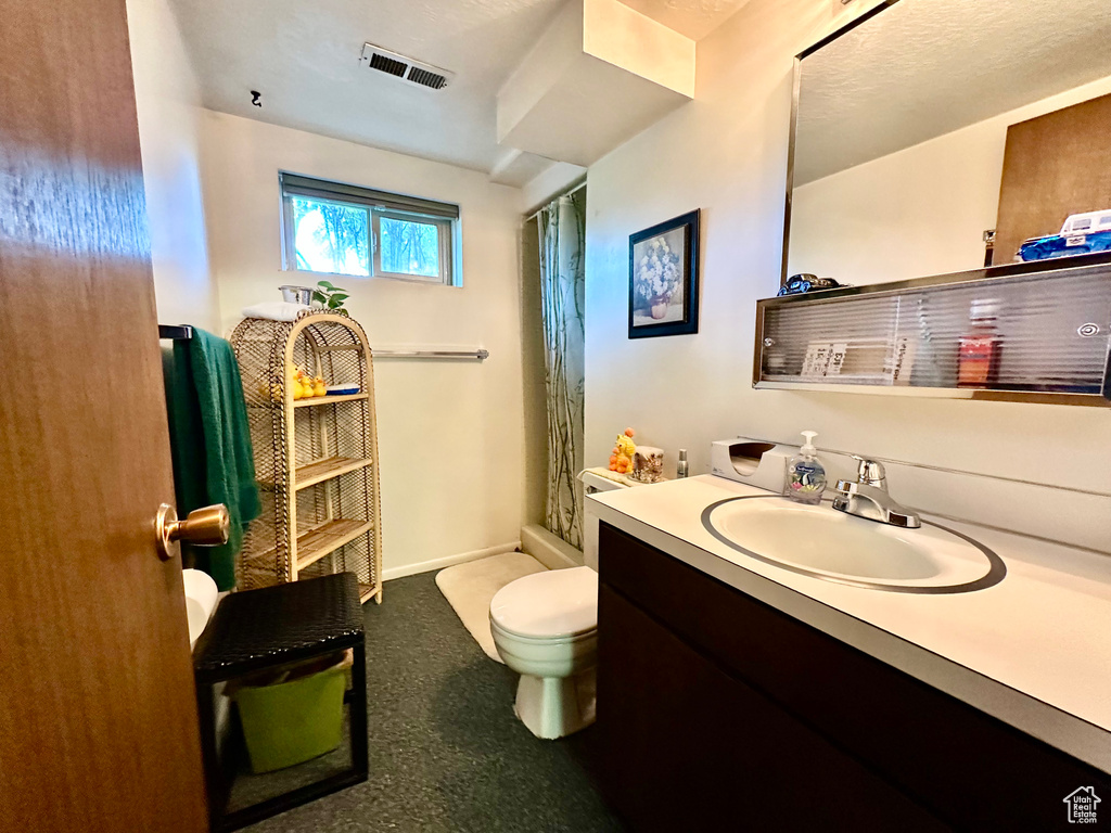 Full bathroom with vanity and a shower with curtain