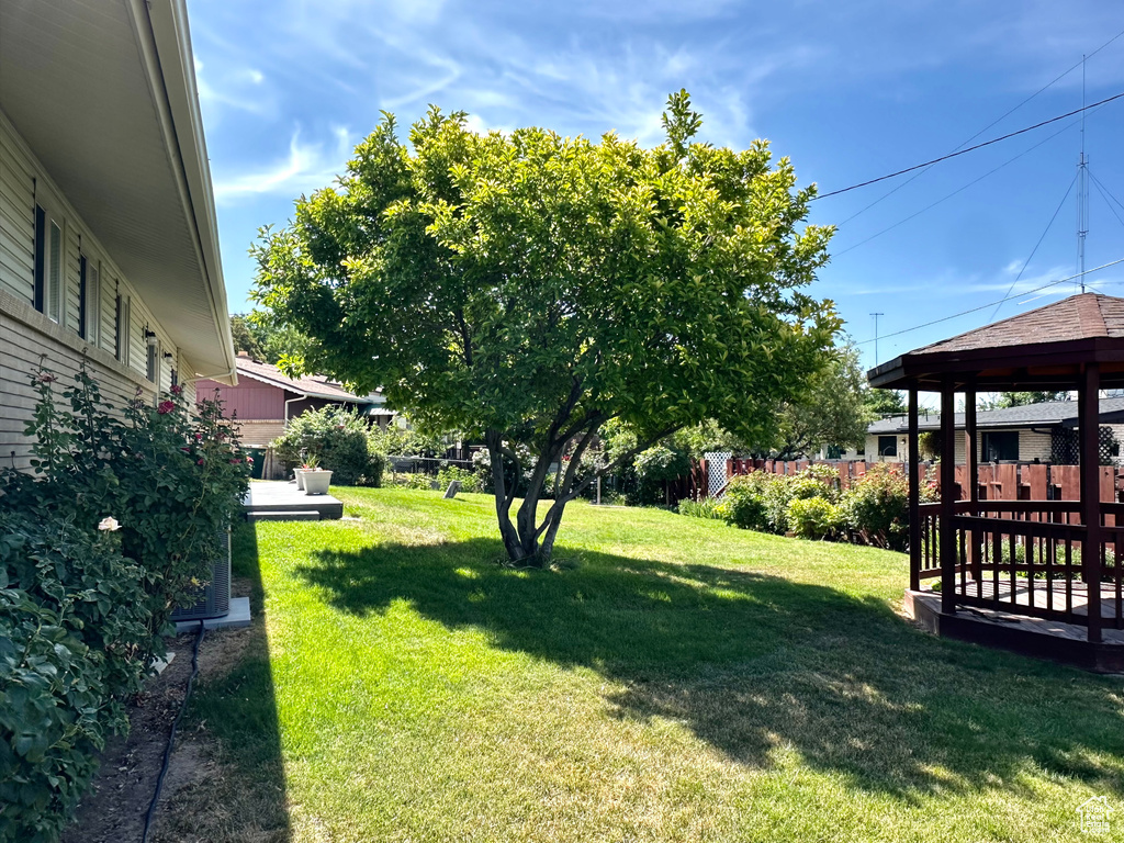 View of grassy yard with a gazebo