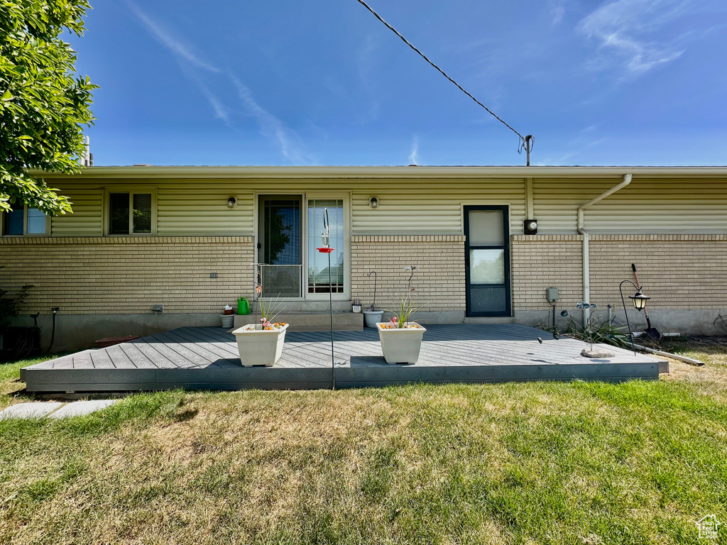 Back of property featuring a deck