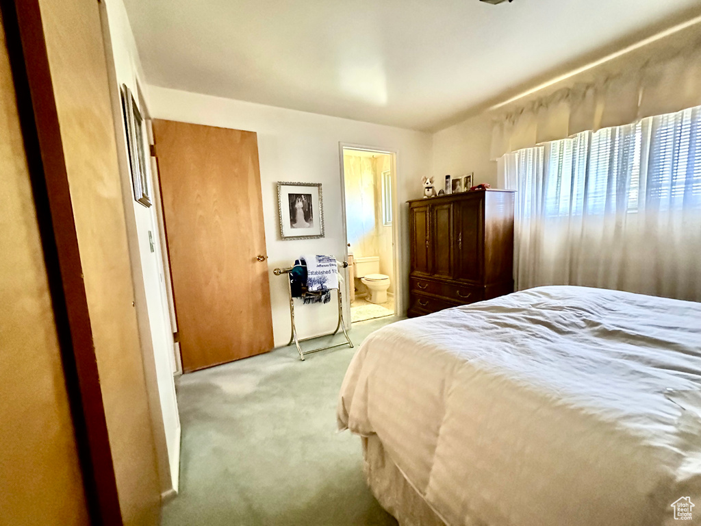 Bedroom with carpet and ensuite bath