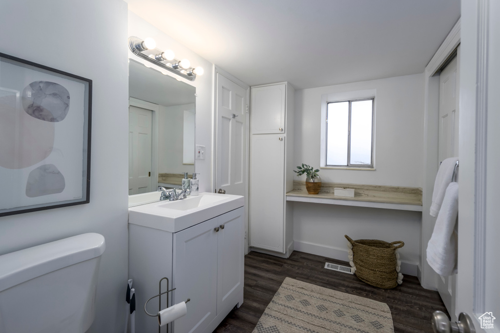 Bathroom with vanity and wood finished floors