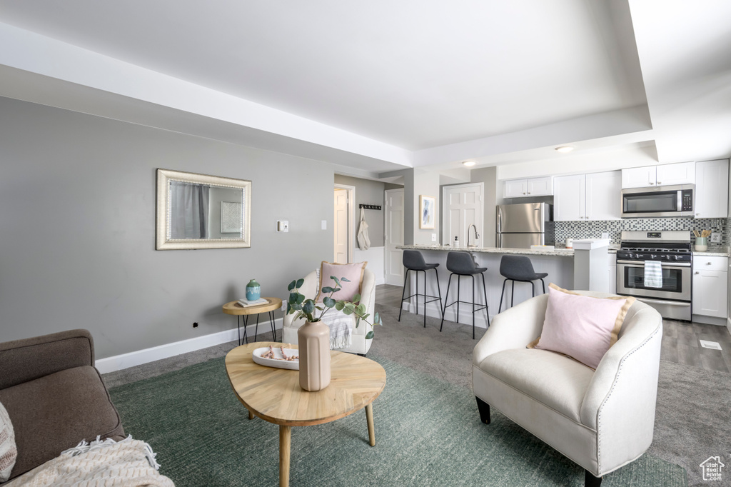 Living area featuring baseboards
