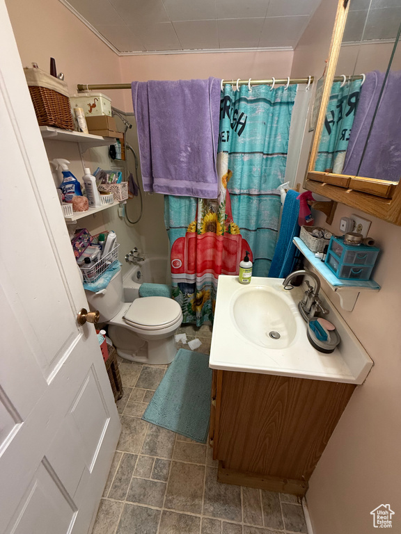 Full bathroom featuring vanity and shower / bath combo with shower curtain
