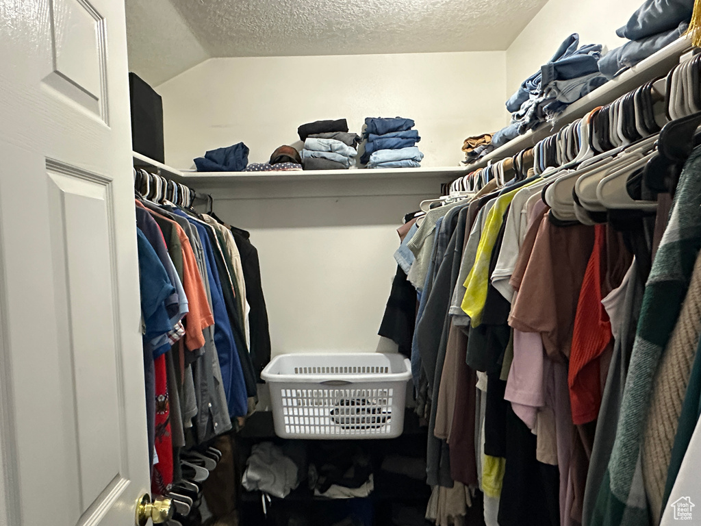 Spacious closet featuring lofted ceiling