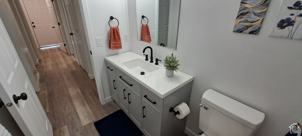 Bathroom featuring vanity and wood finished floors