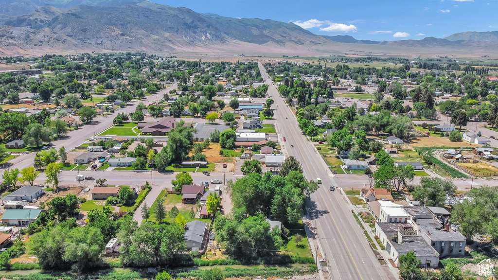 Aerial view of residential area featuring a mountain backdrop