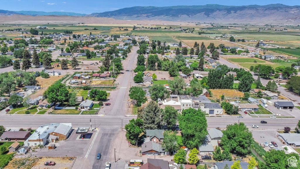 View of property location with mountains and nearby suburban area