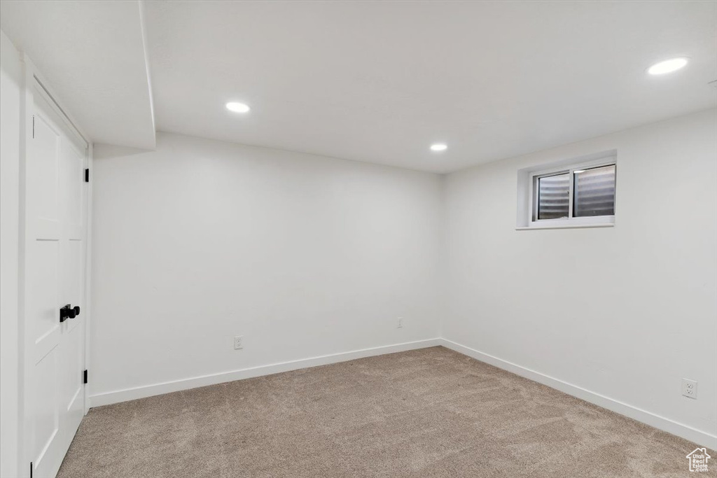 Finished below grade area featuring carpet flooring and recessed lighting