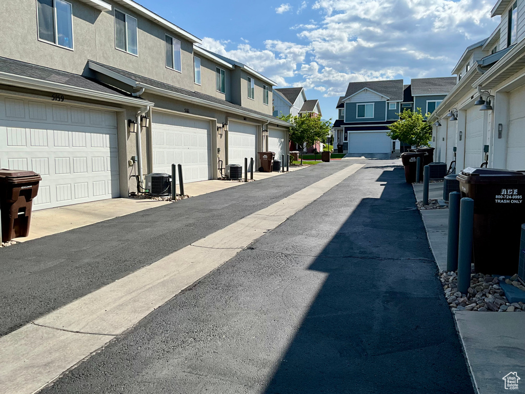 View of asphalt road with a residential view