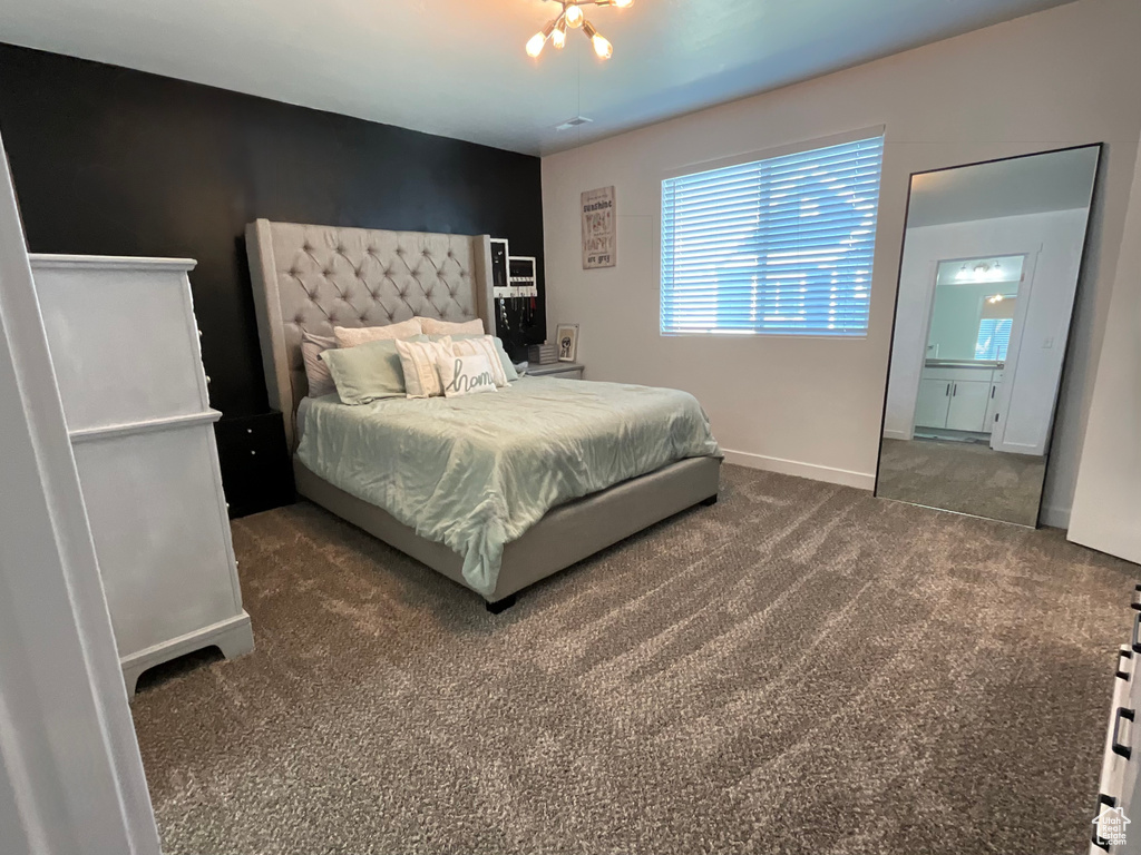 Carpeted bedroom with baseboards