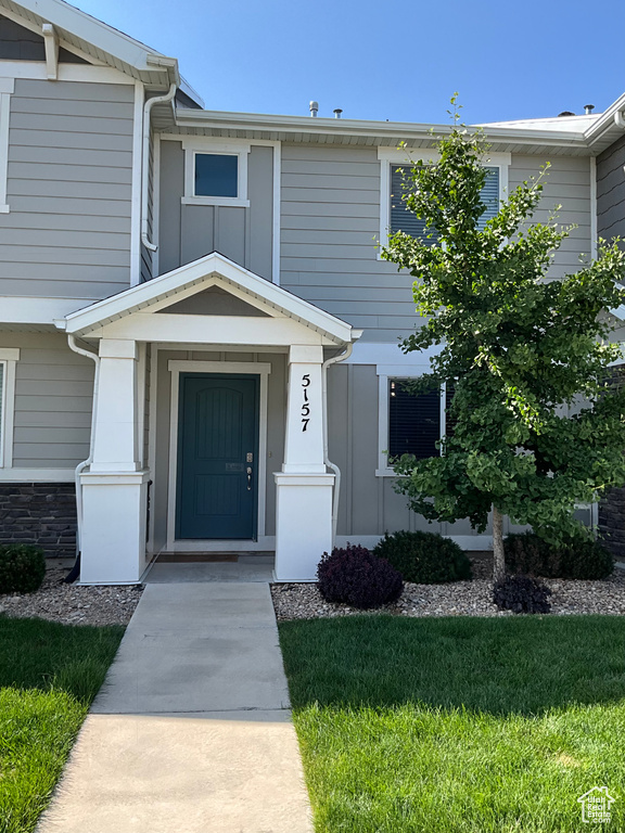 Doorway to property with board and batten siding