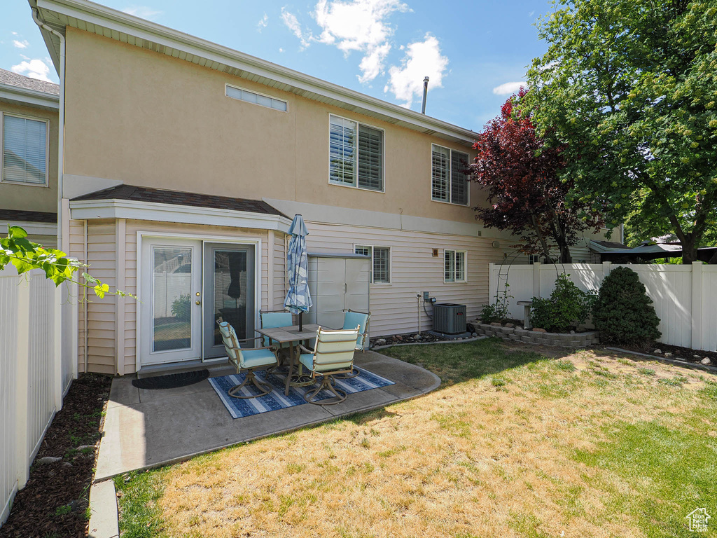 Back of house featuring a patio area and stucco siding