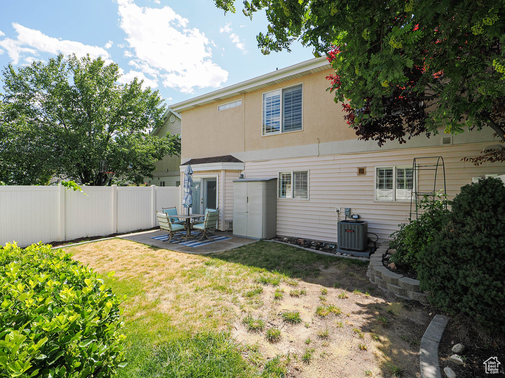 Rear view of property with a patio and stucco siding