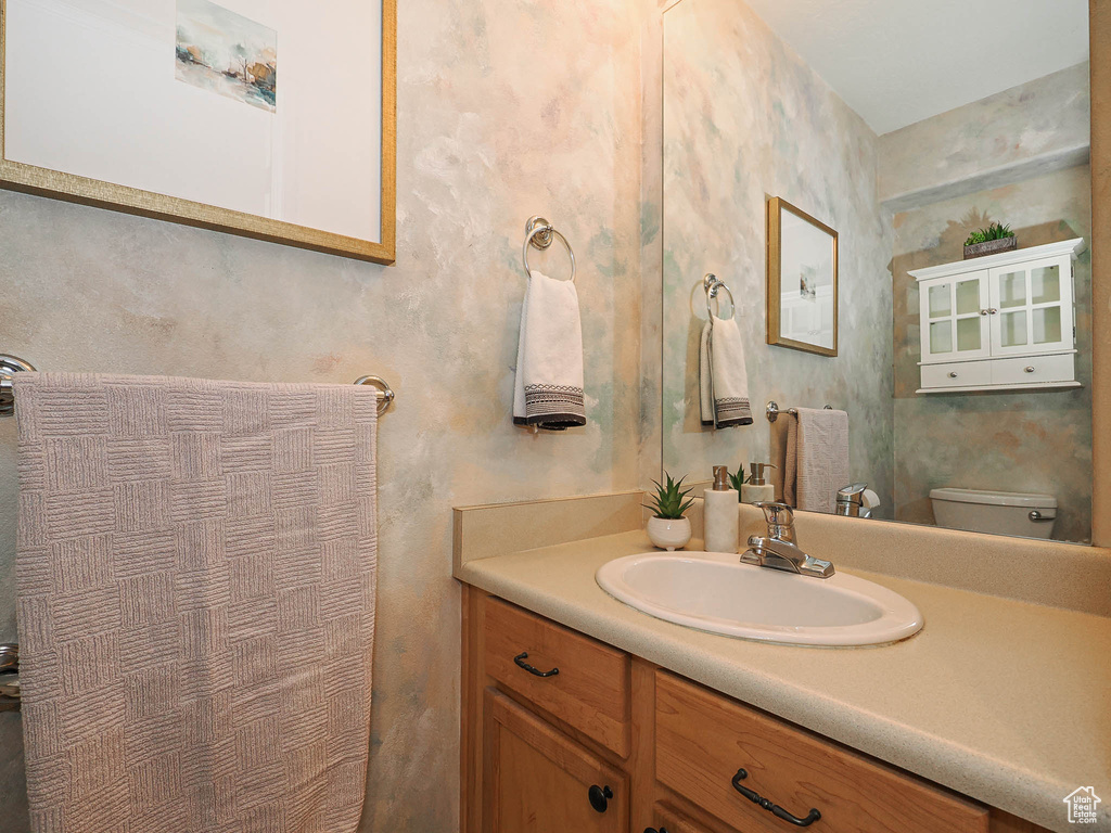 Bathroom with vanity and toilet