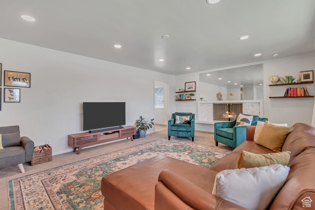 Carpeted living area featuring recessed lighting