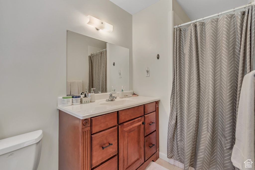 Bathroom featuring vanity and a shower with curtain