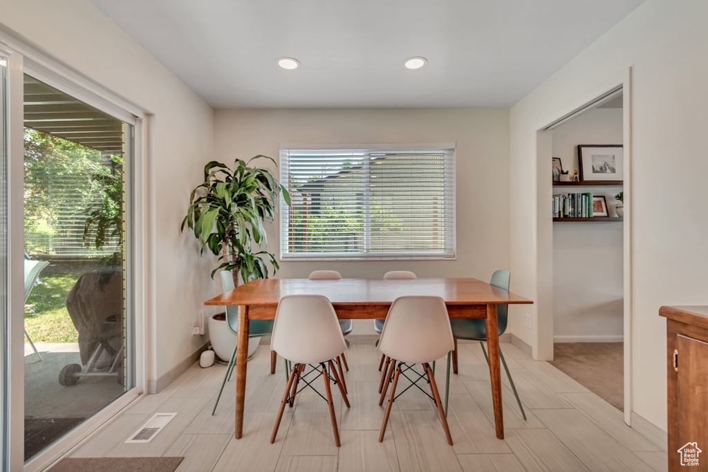 Dining room featuring plenty of natural light and recessed lighting