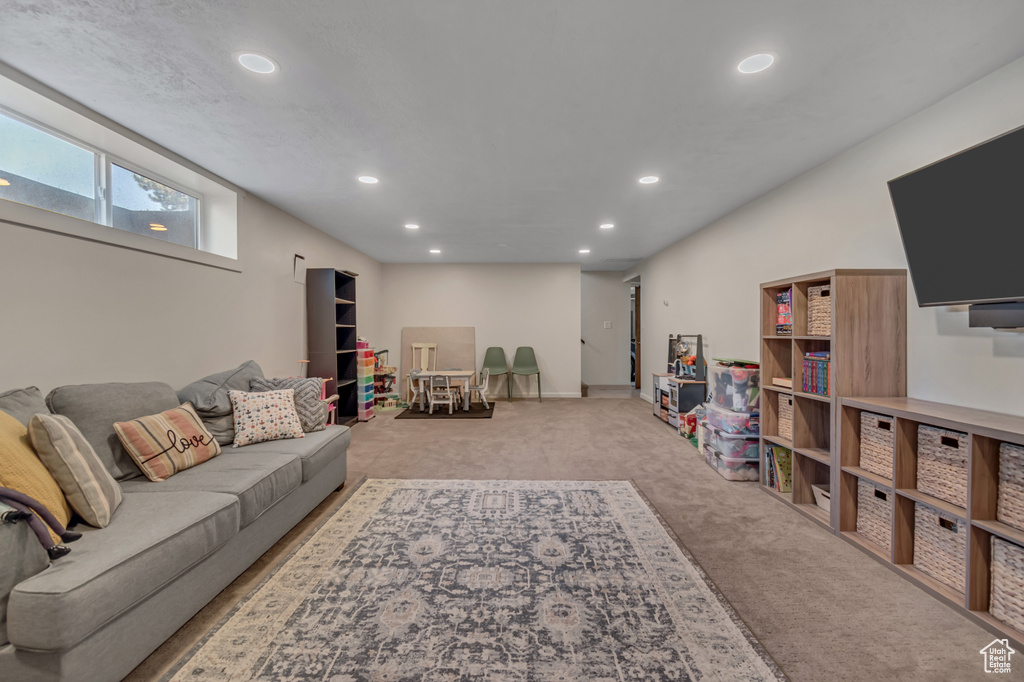 Carpeted living area featuring recessed lighting
