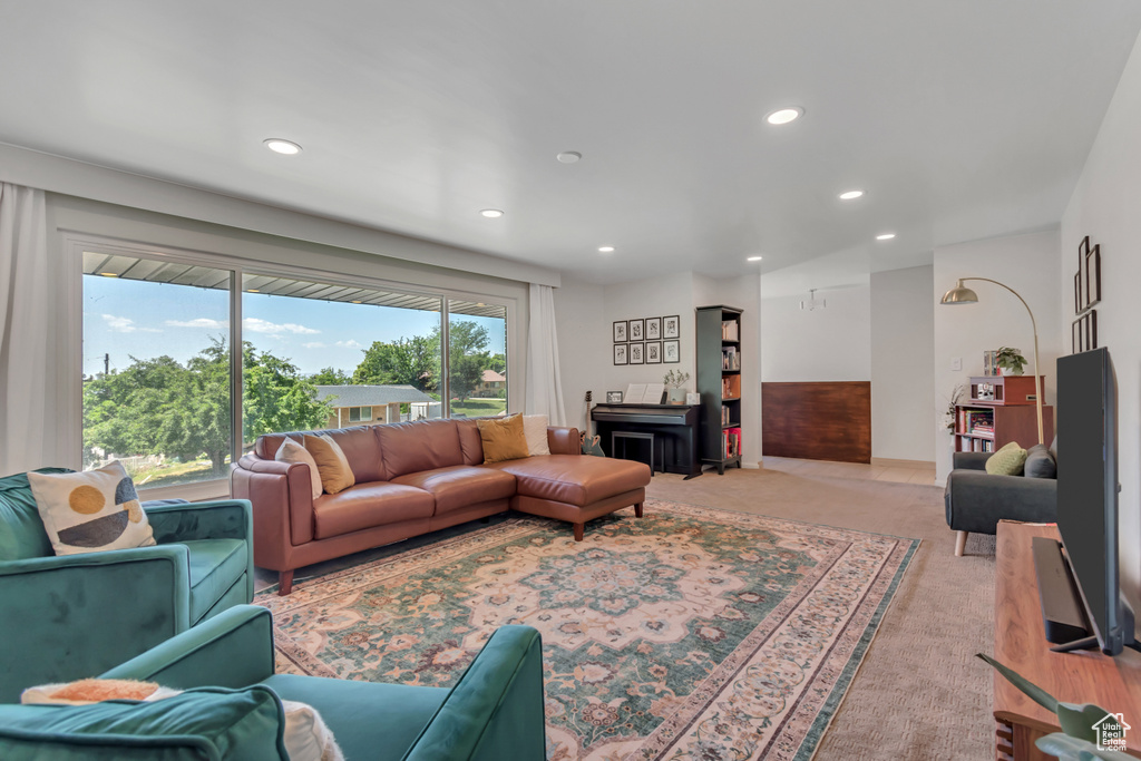 Living area featuring recessed lighting and light colored carpet