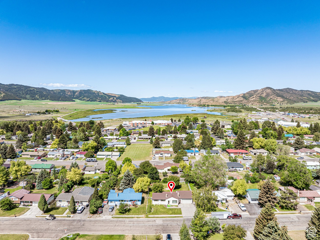 Aerial perspective of suburban area featuring a water and mountain view