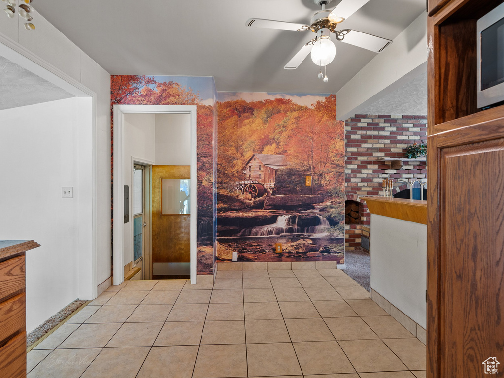 Bathroom with ceiling fan and tile patterned floors
