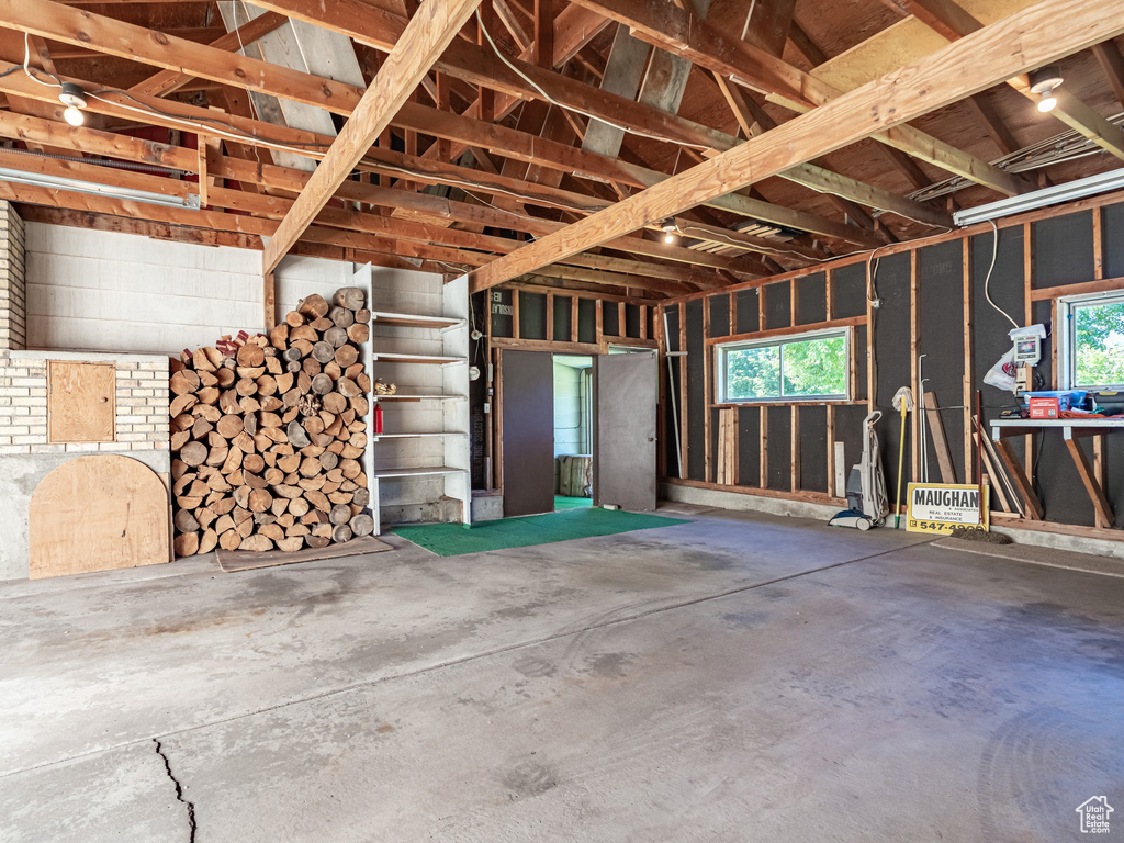 Misc room with a garage and concrete flooring
