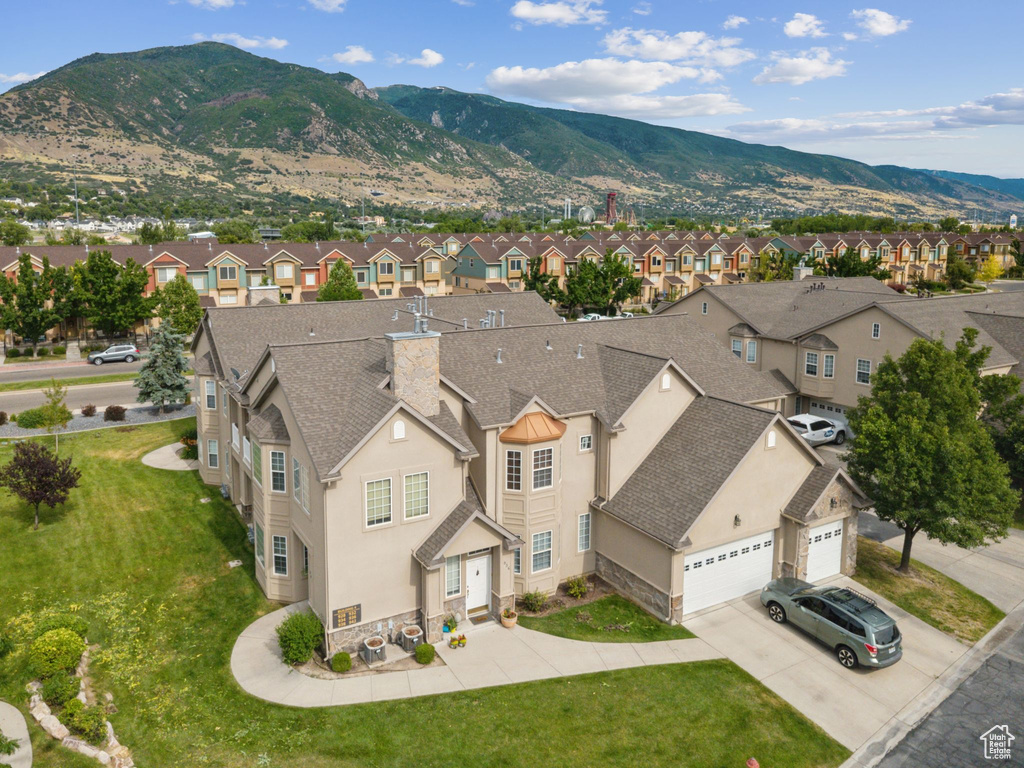 Aerial view of residential area with a mountainous background