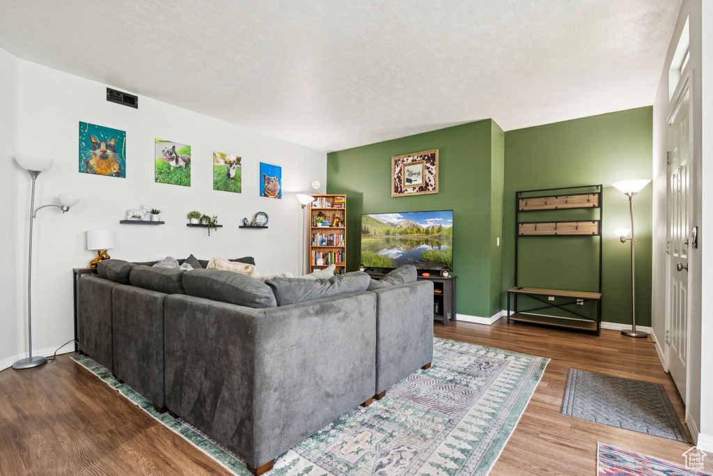 Living room with wood finished floors and baseboards