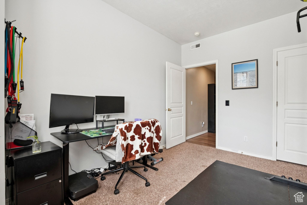 Carpeted office with baseboards