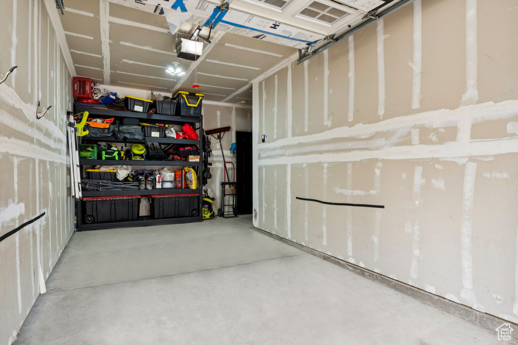 Garage featuring a garage door opener