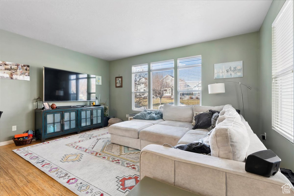 Living room with wood finished floors and baseboards