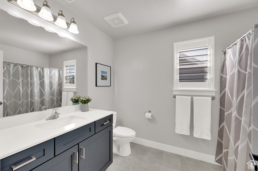 Bathroom featuring vanity and tile patterned floors