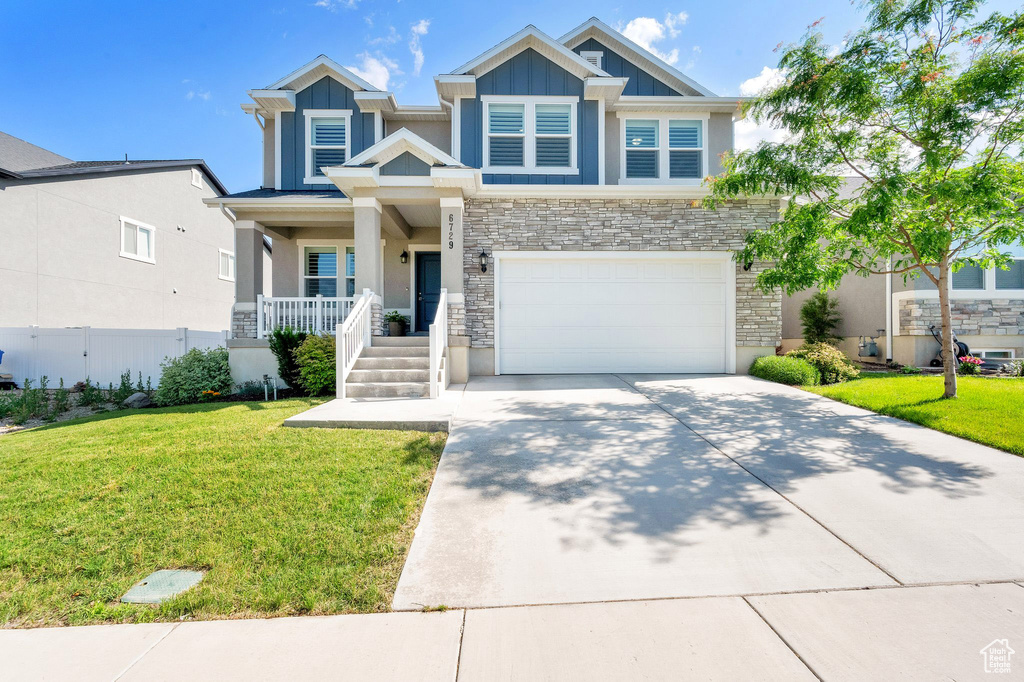 Craftsman house featuring covered porch, concrete driveway, stone siding, an attached garage, and stucco siding