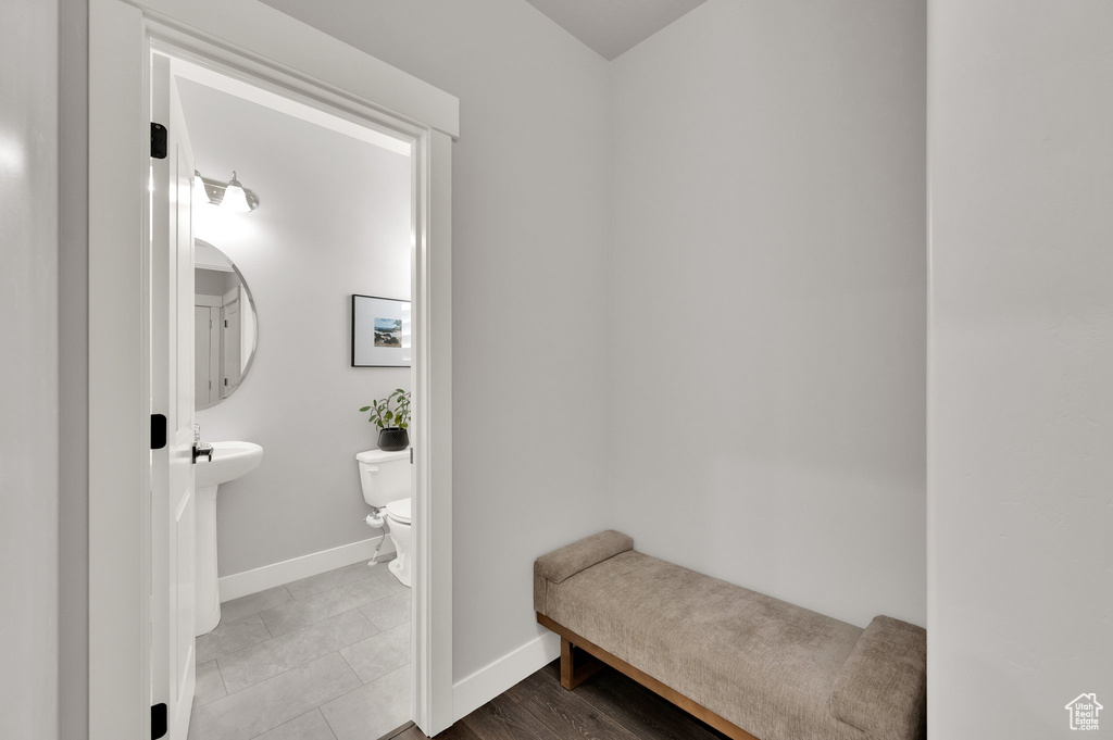 Half bathroom featuring baseboards and tile patterned flooring