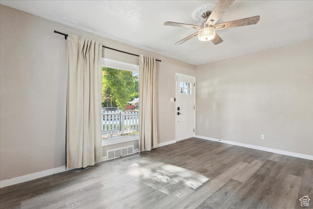 Foyer featuring ceiling fan and wood finished floors