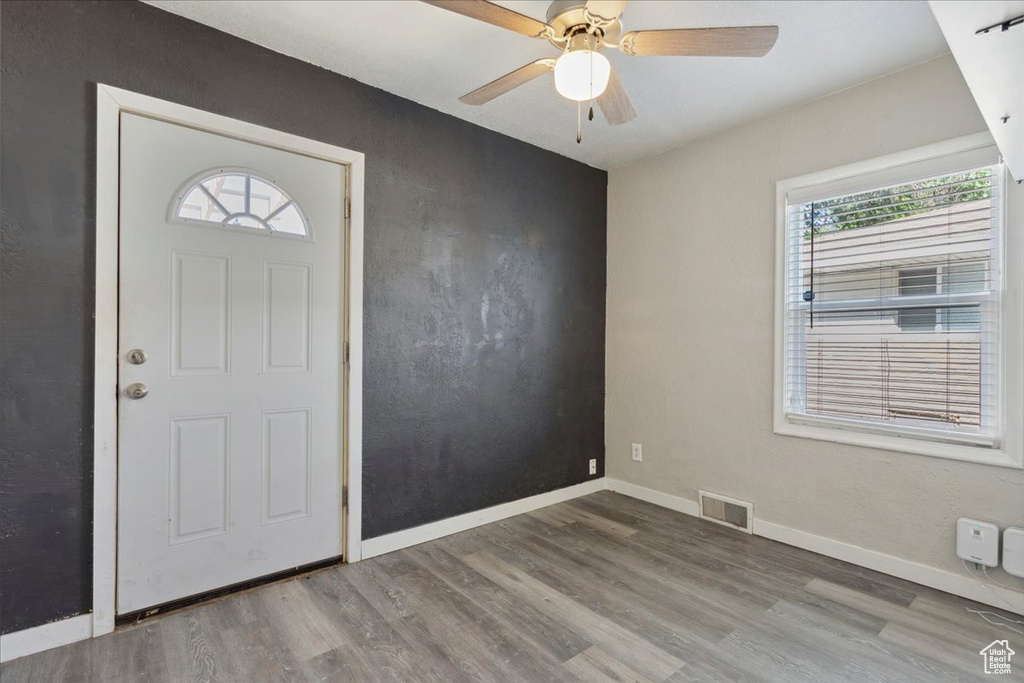 Entrance foyer with wood finished floors and ceiling fan