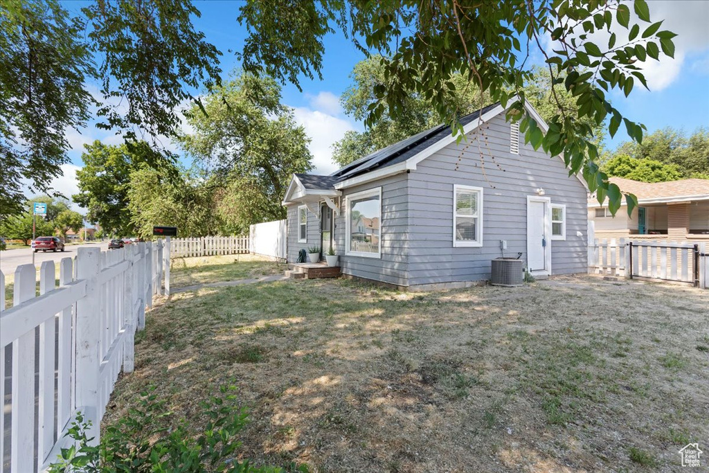 View of property exterior featuring a fenced backyard