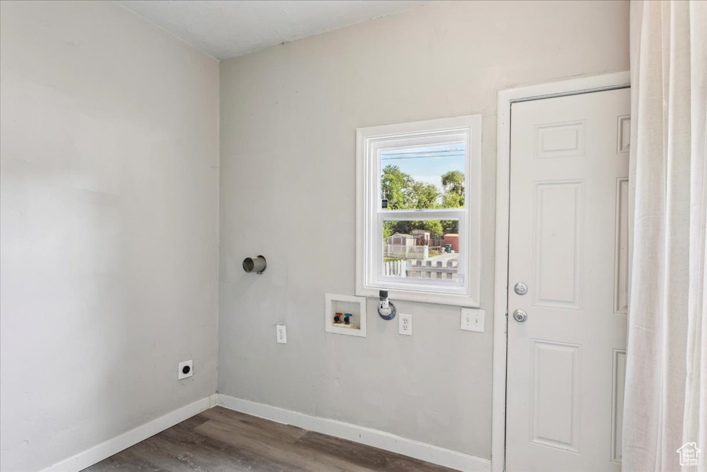 Washroom with electric dryer hookup, dark wood-style floors, and washer hookup