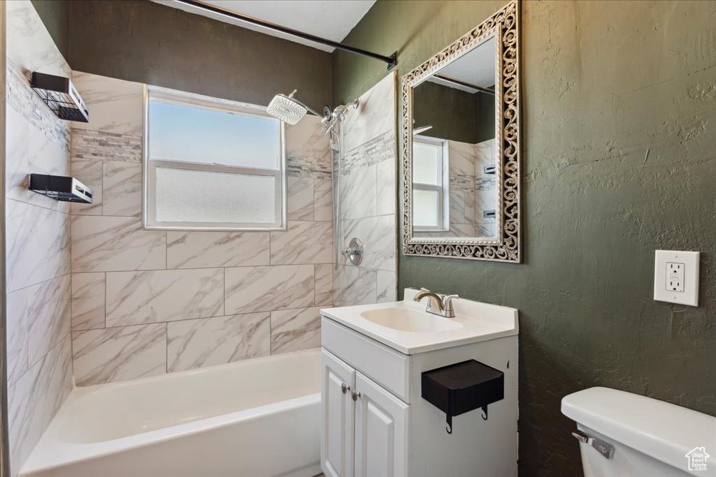 Full bathroom featuring washtub / shower combination and vanity