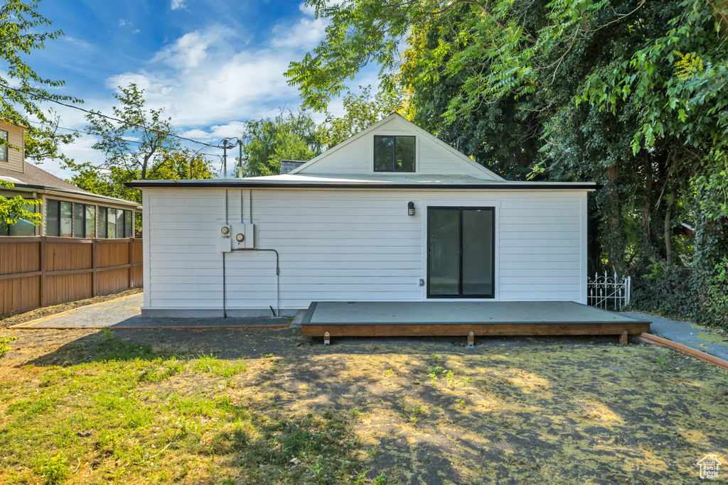 Rear view of property with a wooden deck