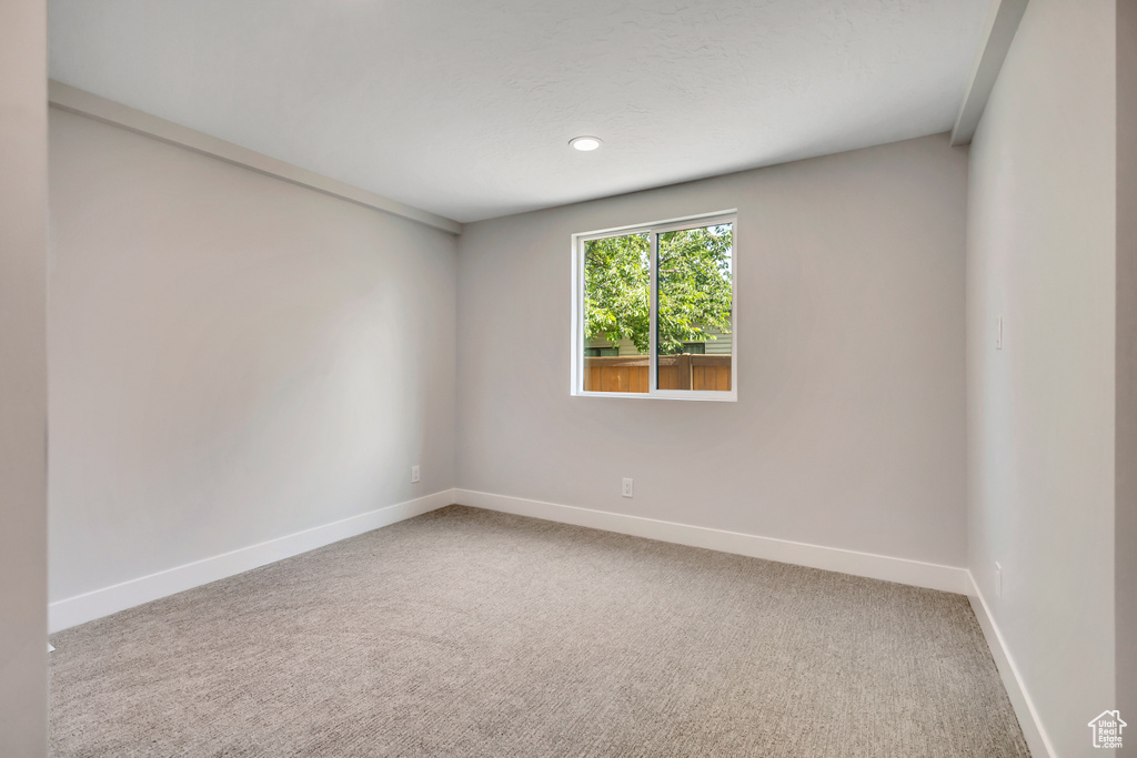 Spare room featuring carpet floors and recessed lighting