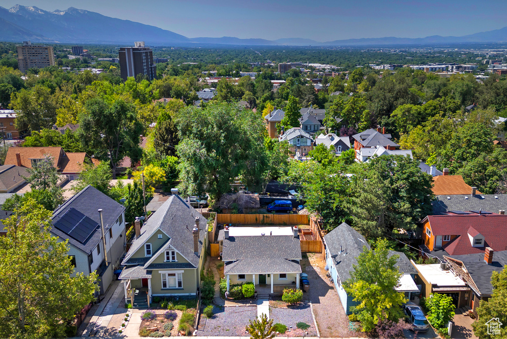 Aerial perspective of suburban area with a mountainous background