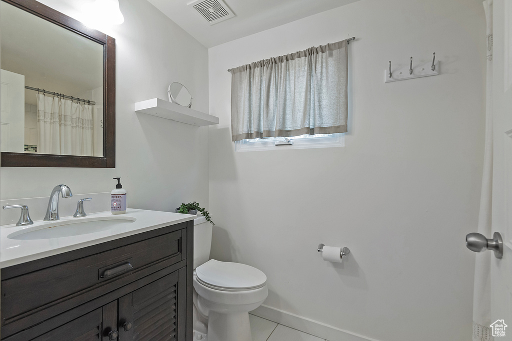 Bathroom with vanity and tile patterned flooring
