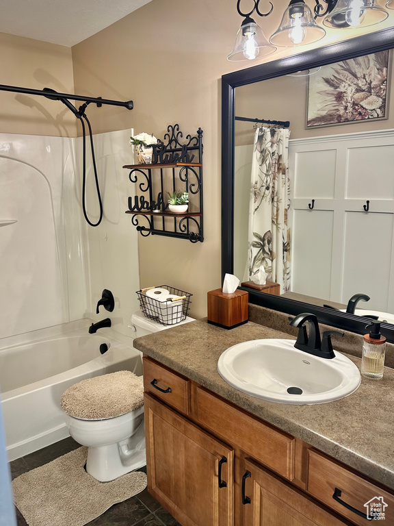 Full bathroom with vanity and shower / bath combo with shower curtain