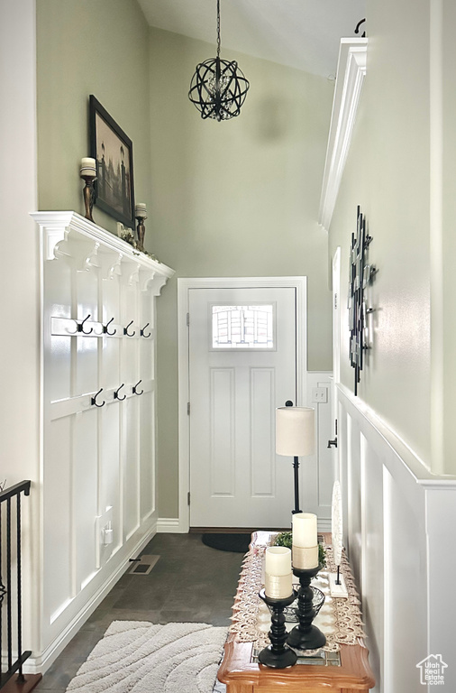 Mudroom with high vaulted ceiling