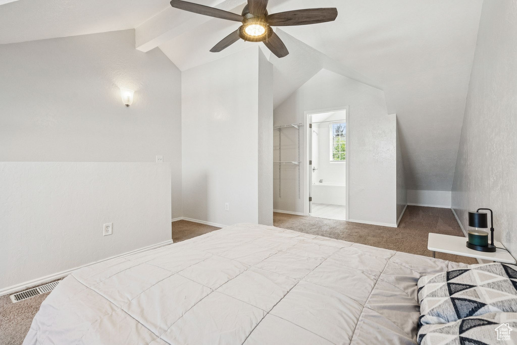Bedroom featuring carpet floors, a ceiling fan, and ensuite bath