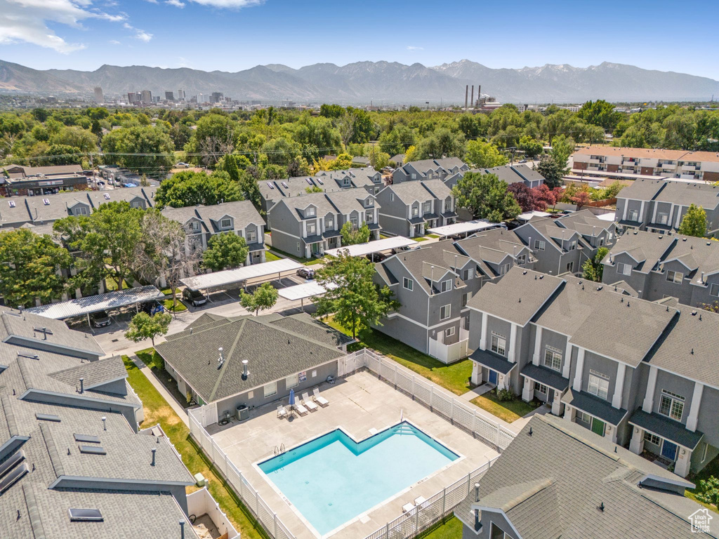 Aerial perspective of suburban area with a mountainous background